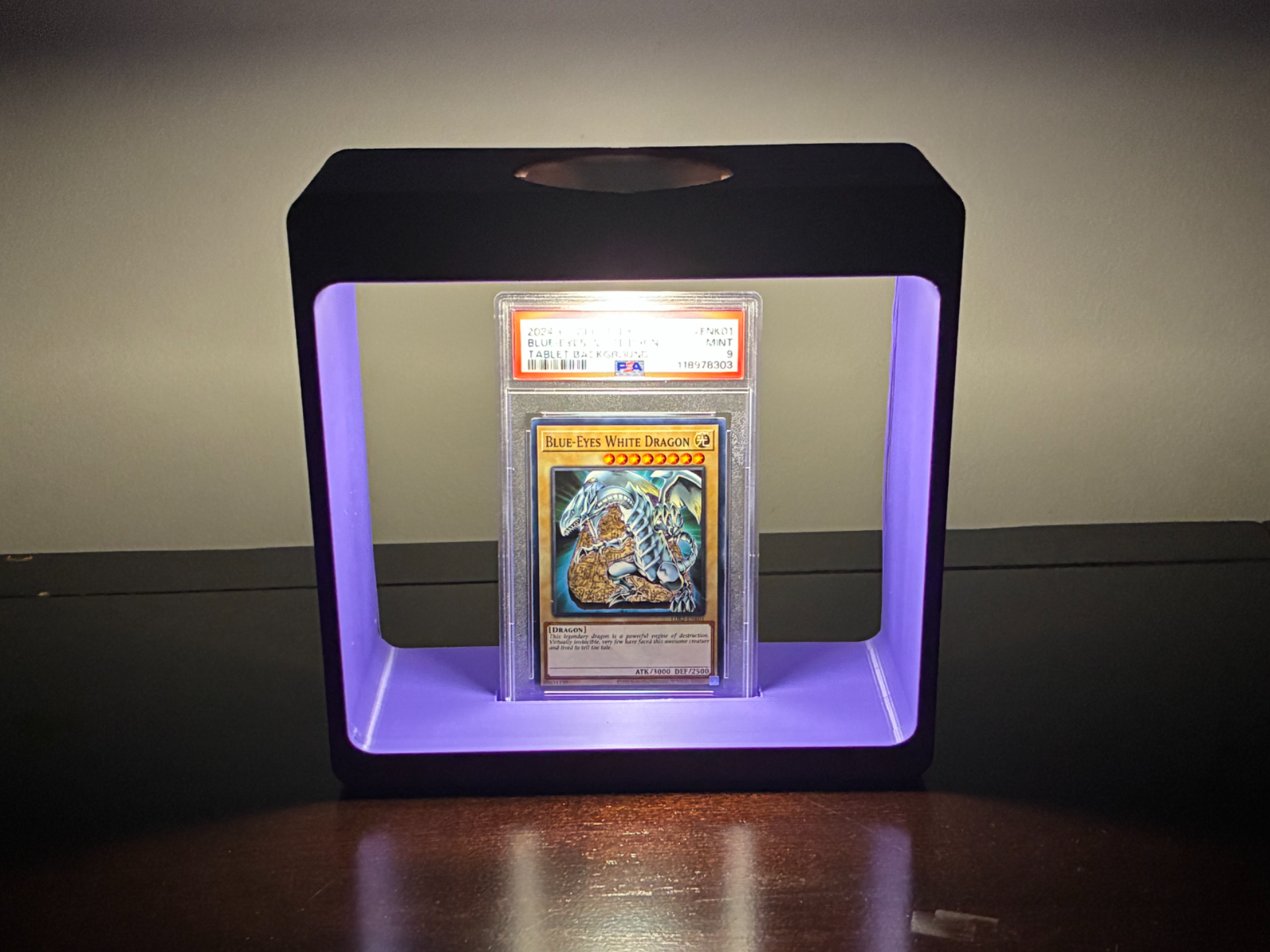 PSA graded card stand with color-changing puck light