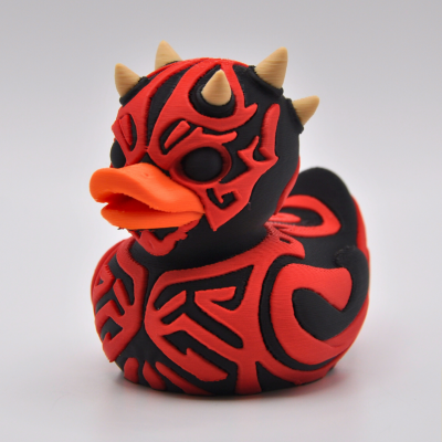 Red-and-black horned space-villain-style collectible duck